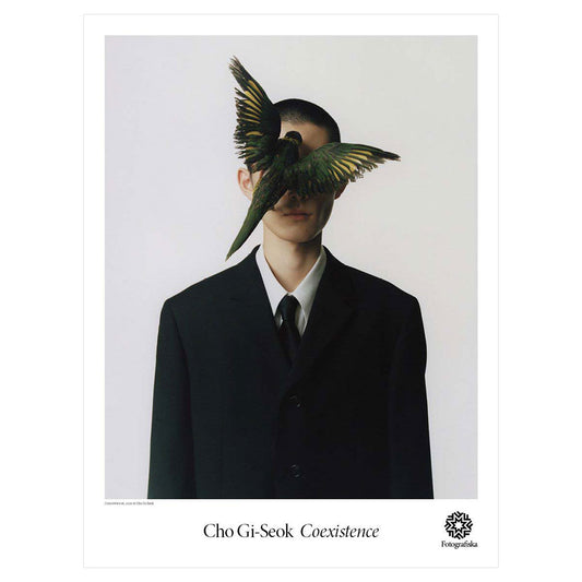 Person with flying bird covering their face.  Exhibition title below: Cho-Gi Seok | Coexistence
