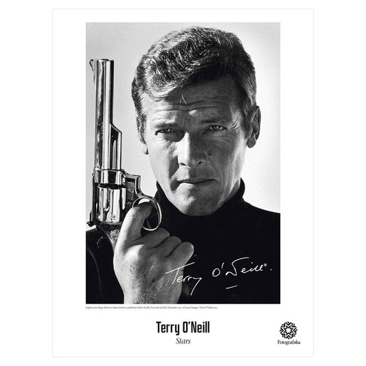 Black and white image of Roger Moore as James Bond, holding a pistol while looking at the camera. Exhibition title below: Terry O'Neill | Stars