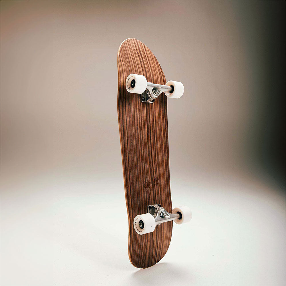 Underside of cork skateboard, made of Walnut, showing 4 wheels.