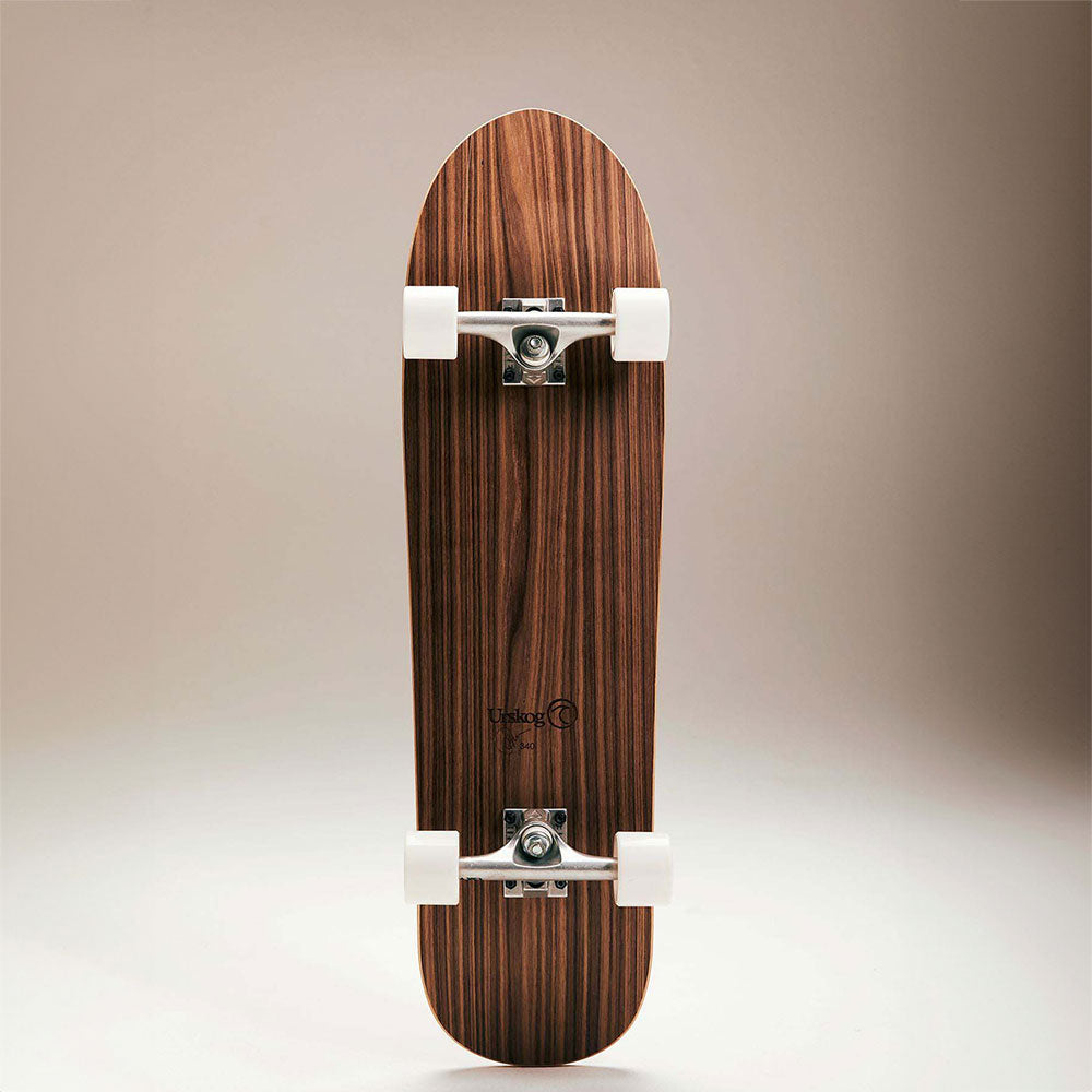 Underside of cork and walnut skateboard, showing wheels