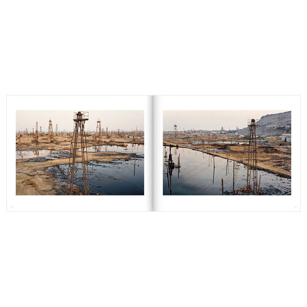 Open spread of Edward Burtynsky: Oil, showing two color photos of oil fields