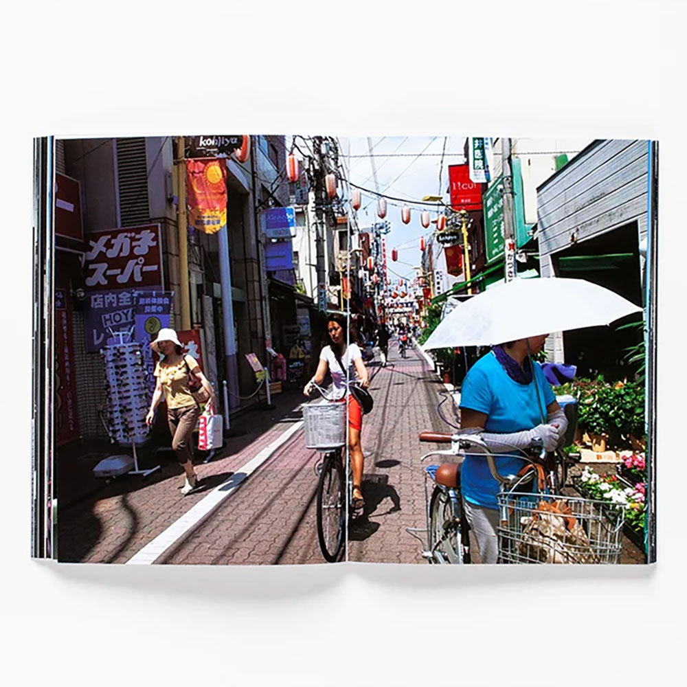 Spread of Daido Moriyama: How I Take Photographs, showing a colorful street photo