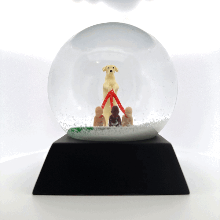 Spinning image of the "Dog Walker" snow globe.