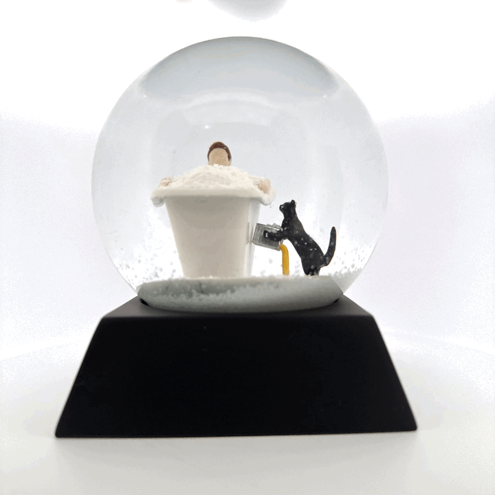 Spinning perspective of the Bad Kitty snow globe, Snow globe with a dark sense of humor: a black cat about to drop a toaster into a bath with its owner in it.