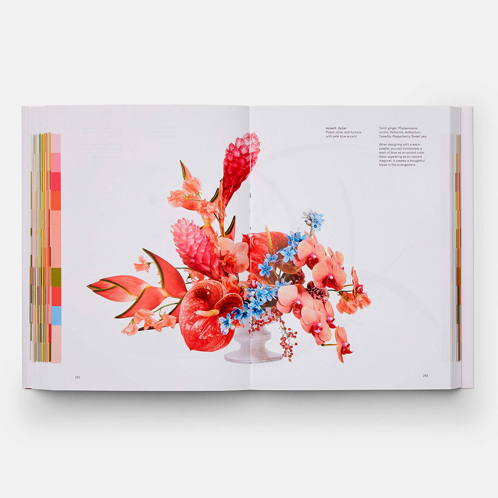 Open book shot of Flower Color Theory, showing color illustrations of flowers with identifying text