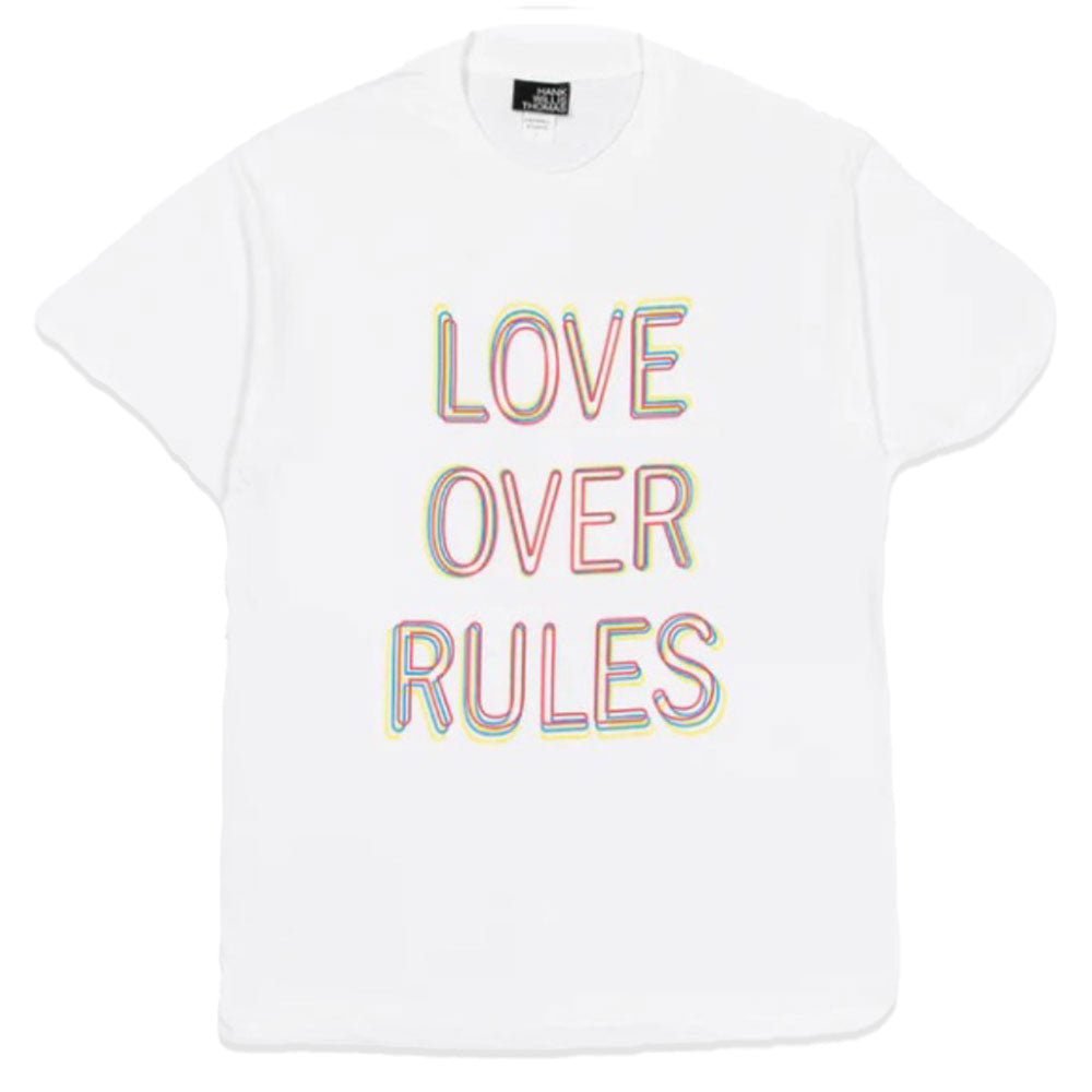 White t-shirt with "Love Over Rules" written on the front