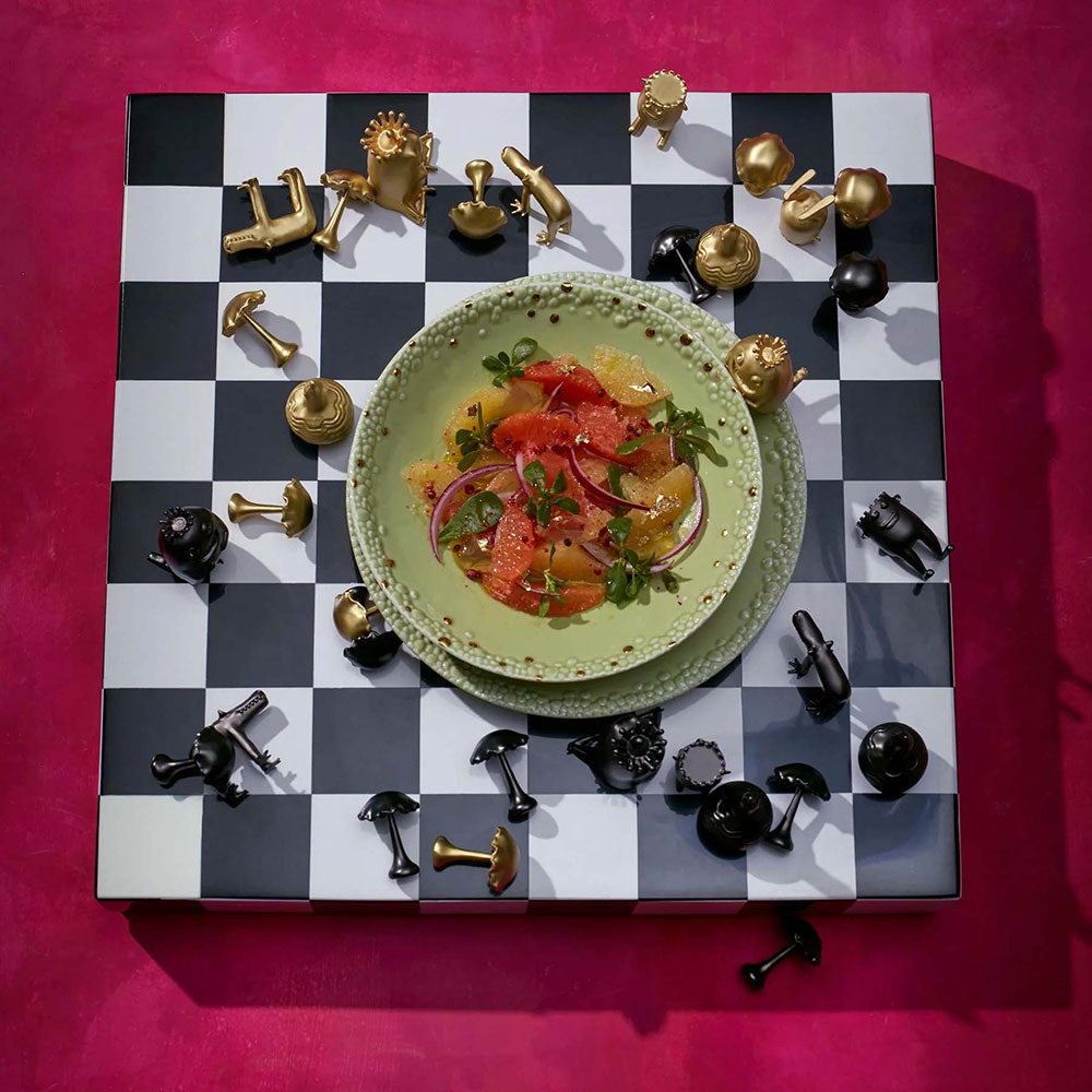 HAAS Chess Set, with a bowl of salsa in the middle