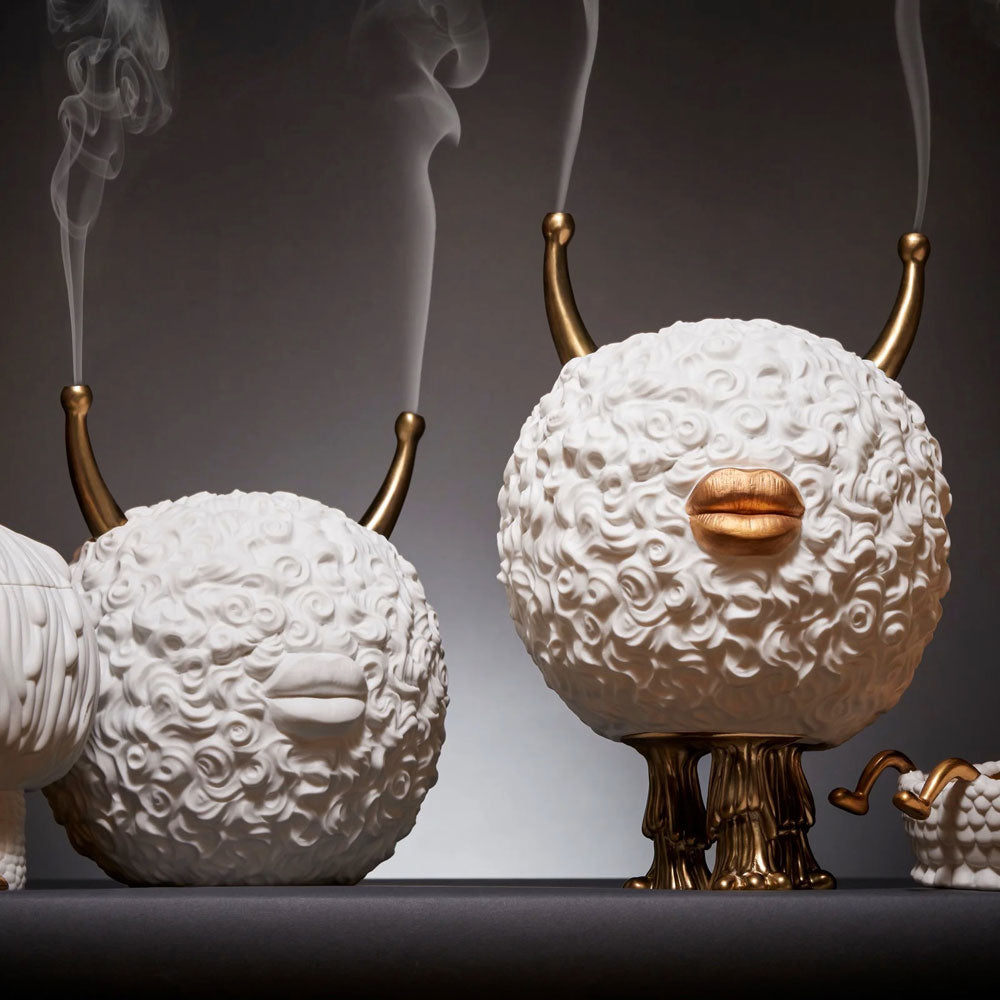 Two Haas Incense Burner Monsters, a quirky and strange design well-crafted; a giant hairy ball with lips and golden horns