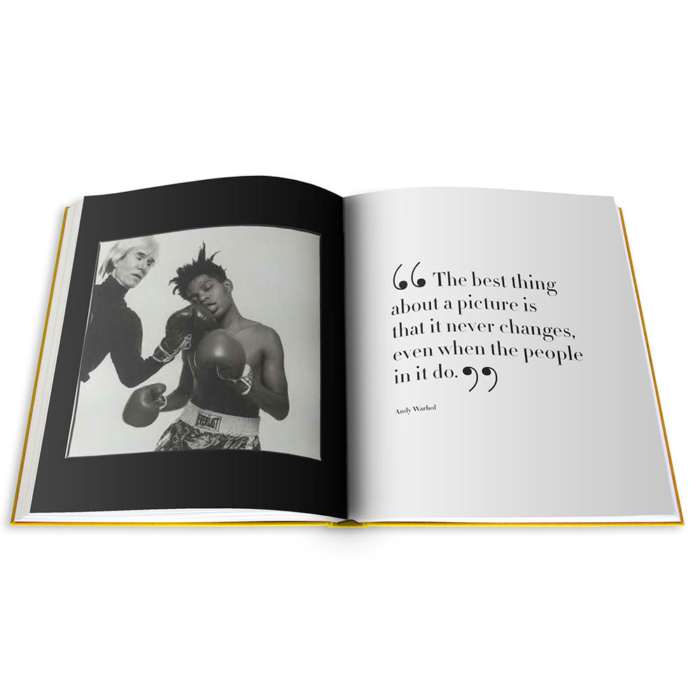 Spread of Andy Warhol: The Impossible Collection, showing black and white photo of Warhol and Basquiat on the left and text on the right
