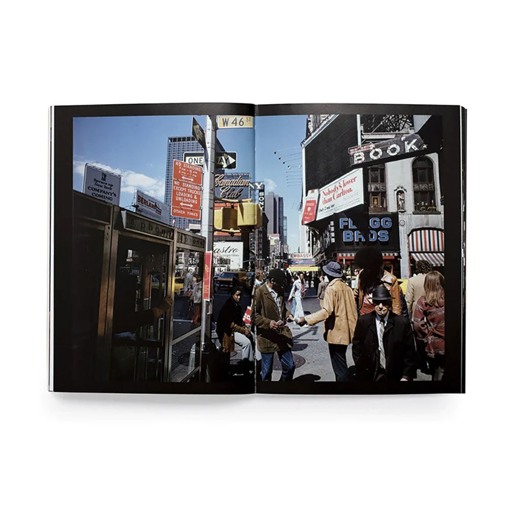 Spread shot of Joel Meyerowitz: How I Make Photographs, showing full-width color image of a city street scene