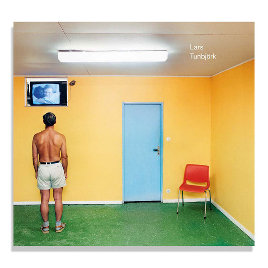 Cover of Lars Tunbjork: Retrospective, showing a man alone in a yellow room watching television.