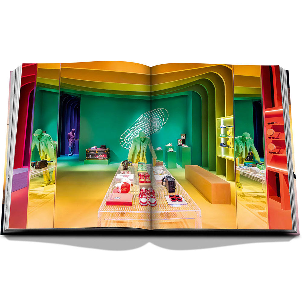 Spread of Louis Vuitton: Virgil Abloh, The Ultimate Collection, showing full-width color image of a vibrant indoor setting.