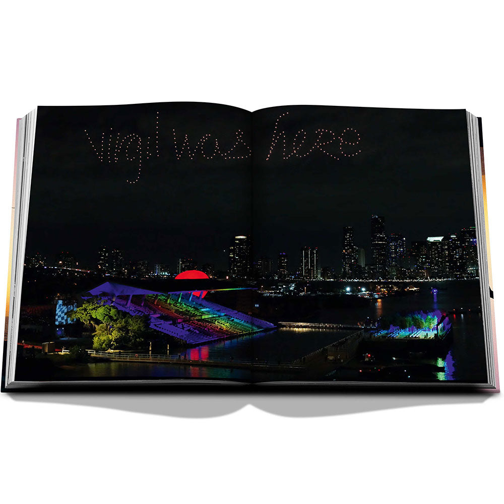 Spread of Louis Vuitton: Virgil Abloh, The Ultimate Collection, showing full-width color image of a night sky with "Virgil was here" written in the sky