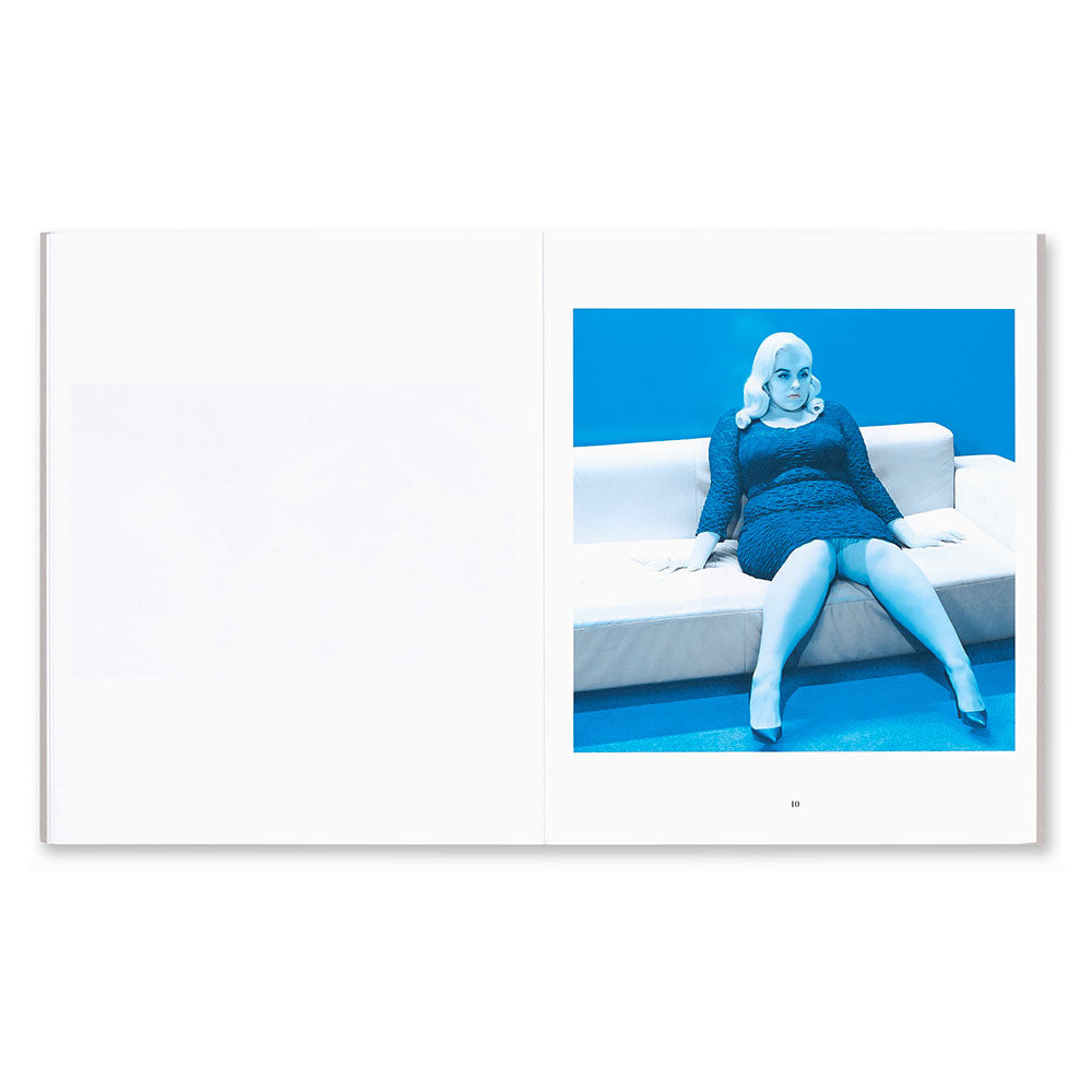 Open spread shot of Miles Aldridge: One Black & White and Nineteen Colour Photographs, showing color photo of a person on a sofa on the right