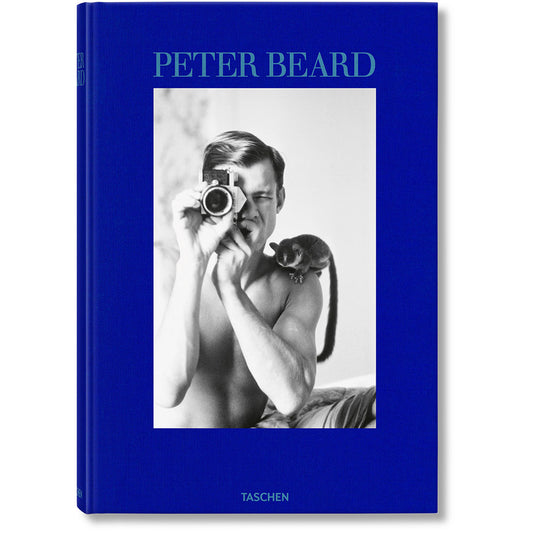 Cover of Peter Beard book, showing black and white photo of man photographing the viewer
