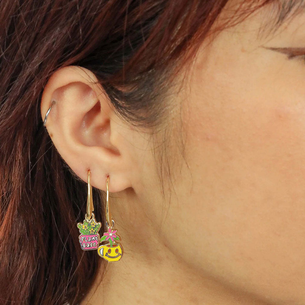 Plant Babe Earrings, worn on the ear.
