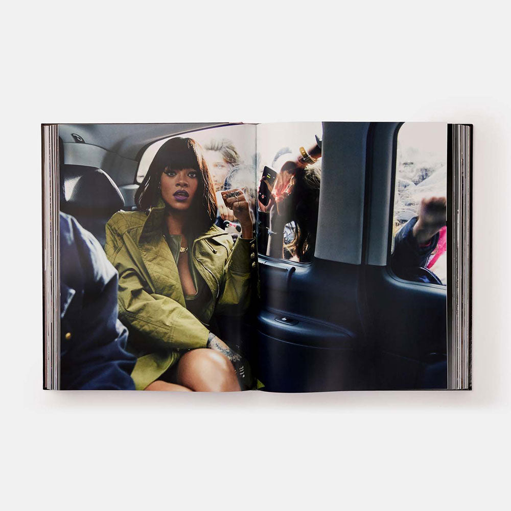 Rihanna, open and showing photographs