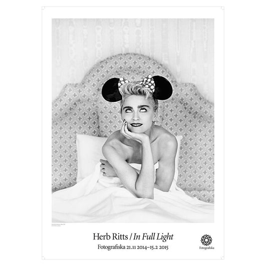 Black and white image of Madonna wearing Mickey Mouse ears with rolled eyes.