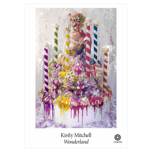 Colorful portrait of woman atop a cafe with giant candles. Exhibition title below: Kirsty Mitchell | Wonderland