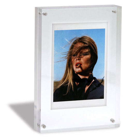 A5 acrylic photo frame with sultry image of woman outdoors.