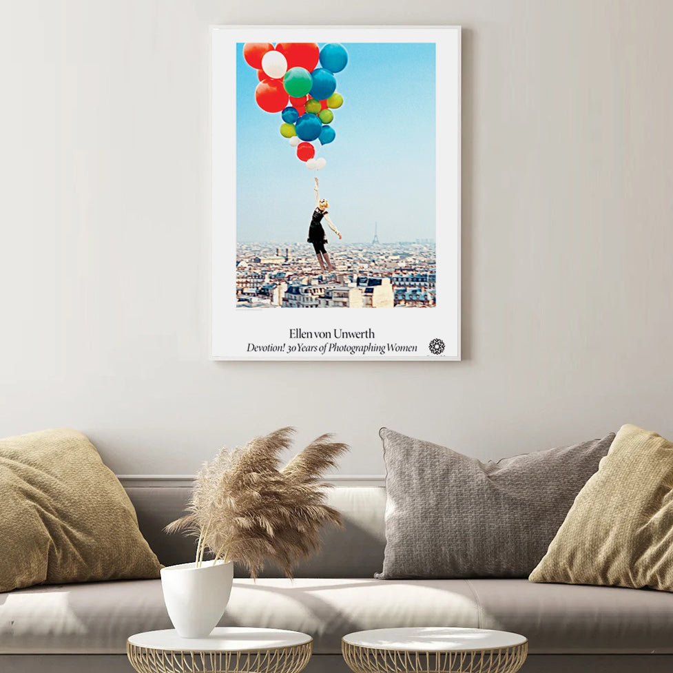 Bye Bye Paris poster on beige wall with brown couch