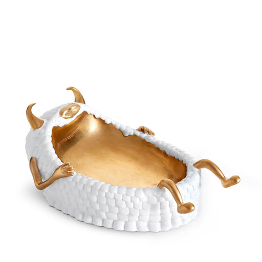 White bowl with gold interior.  Gold horns, arms, and legs