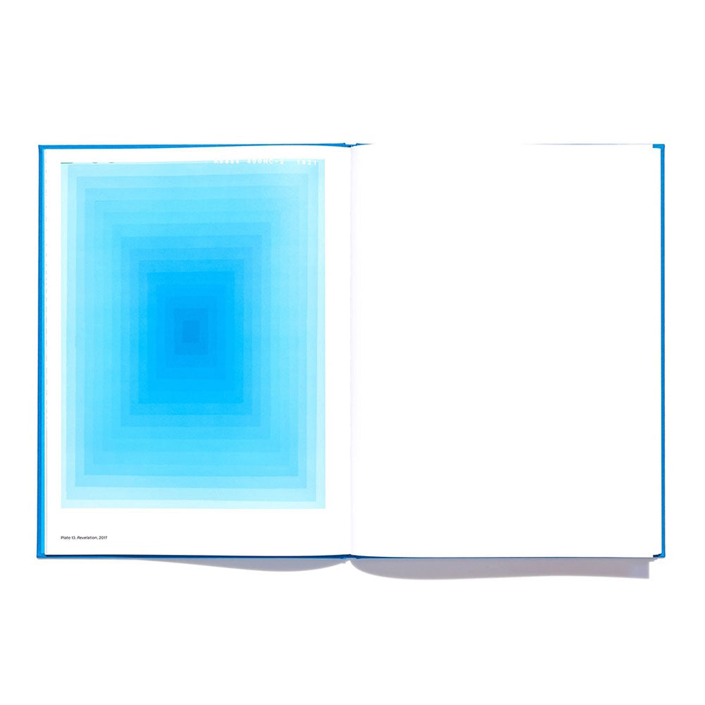 Blue book opened showing blue artwork