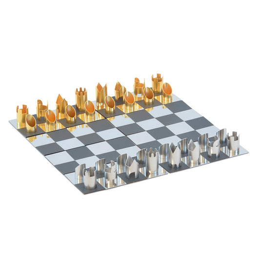 Gold and silver chess pieces on chessboard