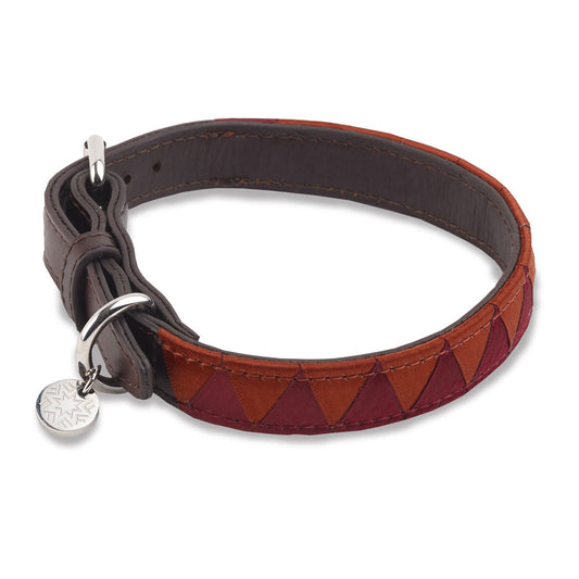Fotografiska dog collar in orange and burgundy, made of vegetable tanned leather and metal tag with fotografiska logo.  Part of the Fotografiska Essentials product collection.