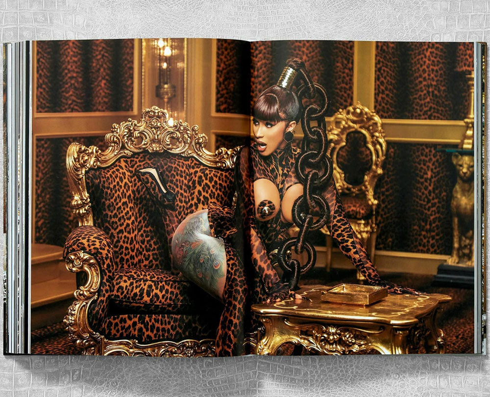 Ice Cold: Hip-Hop Jewelry History spread shot, showing full-width color photo of female hip hop artist on extravagant couch.