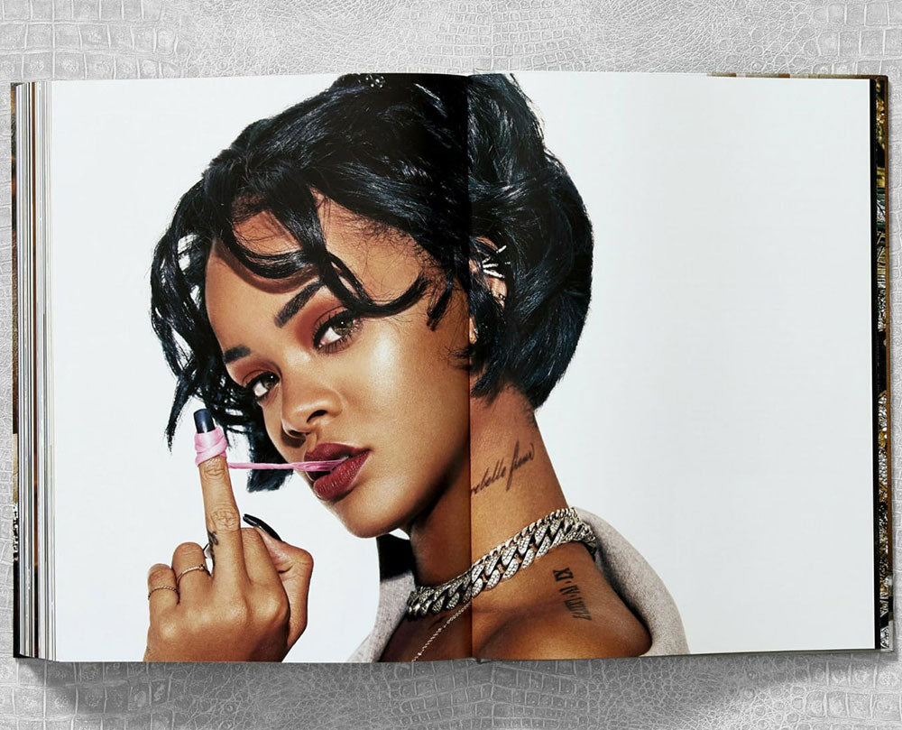Ice Cold: Hip-Hop Jewelry History spread shot, showing full-width color photo of Rihanna showing her middle finger