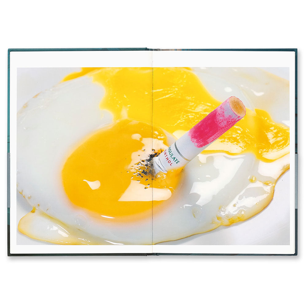 Miles Aldridge: The Cabinet, open to a full-width image of a cigarette with lipstick put out on a fried egg.