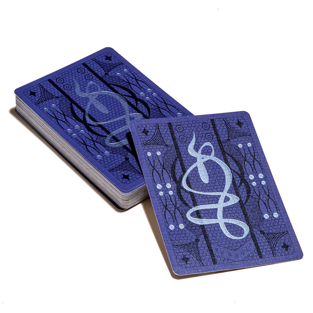 Decorative backs of the Pur-Suit deck cards in purple with white dots and drawings