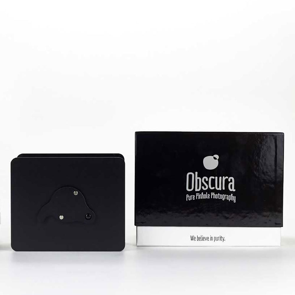 Obscura pinhole camera kit besides sleek packaging.