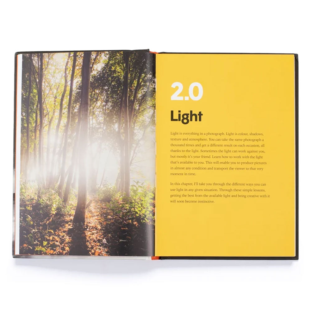 Spread of the Pocket Photographer. The text to the right indicates it's a instructional chapter on light and the the left is an image of a nature with sunlight