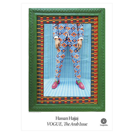 Close up of legs of male model, in vibrantly patterned outfit against colorful backgrounds and frames. Exhibition title below: Hassan Hajjaj | Vogue, The Arab Issue