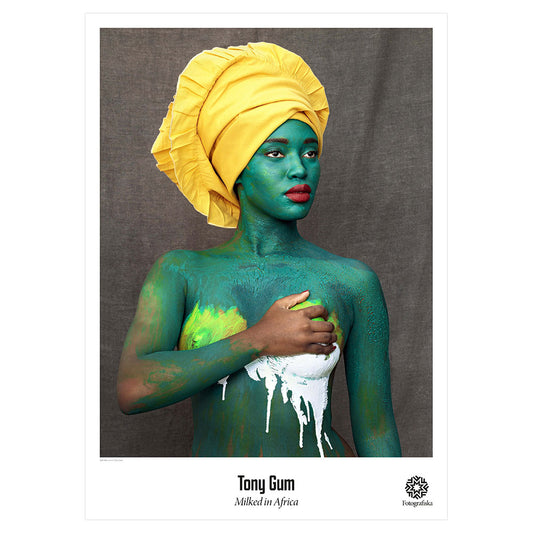 Woman covered in green tones and yellow towel. Exhibition title below: Tony Gum | Milked in Africa
