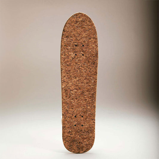 Cork skateboard standing on its end.