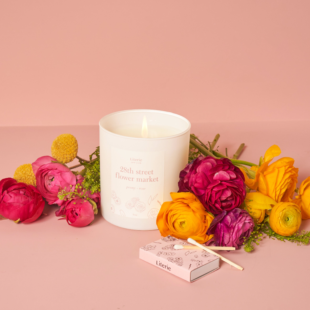 28th Street Flower Market Candle by Literie Candles, in a bouquet of flowers.