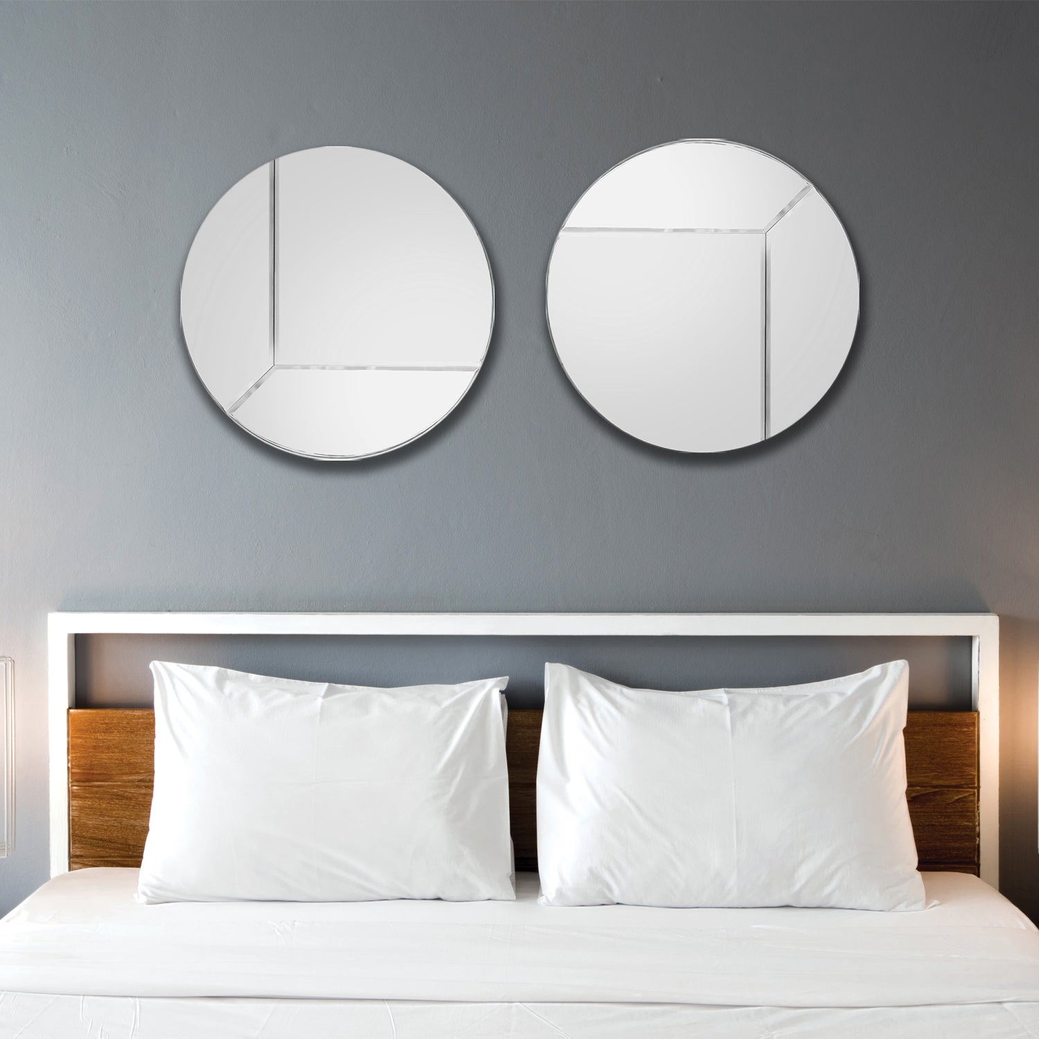 Round Reversible Mirror, XL, set of 2 above a bed.