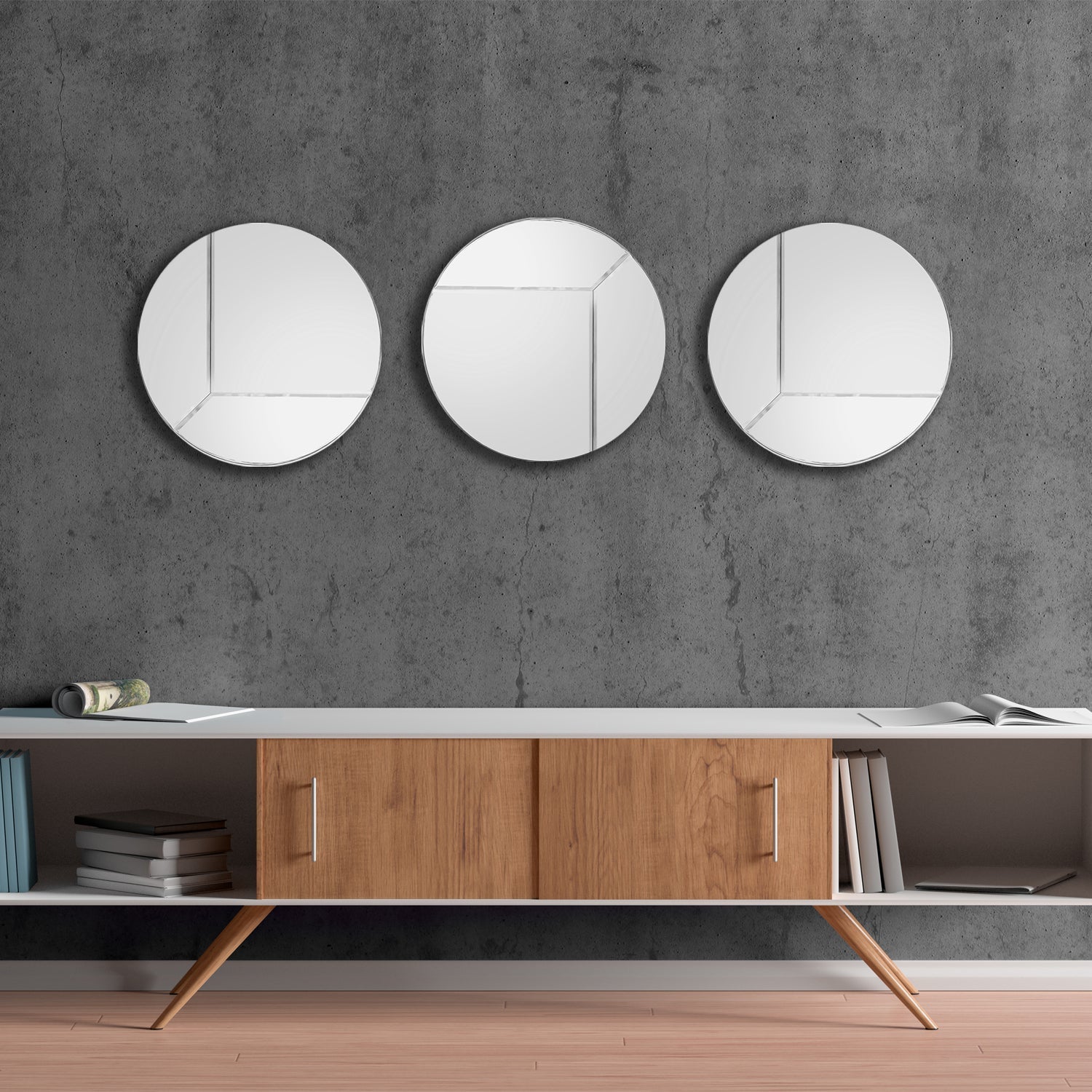 Round Reversible Mirror, XL, set of 3 in a living room above a TV table.