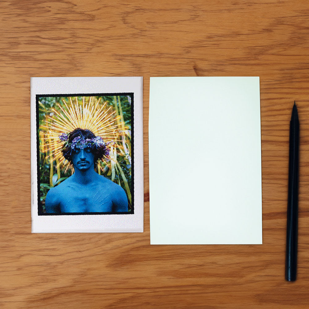 David LaChapelle notecard next to white envelope and ballpoint pen