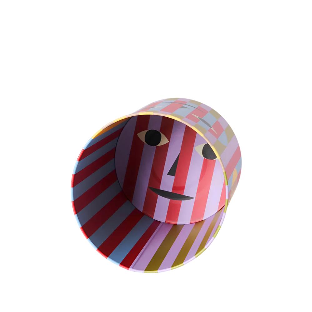 Trash bin with a fun a quirky design - colorful stripes behind a transparent smiley face