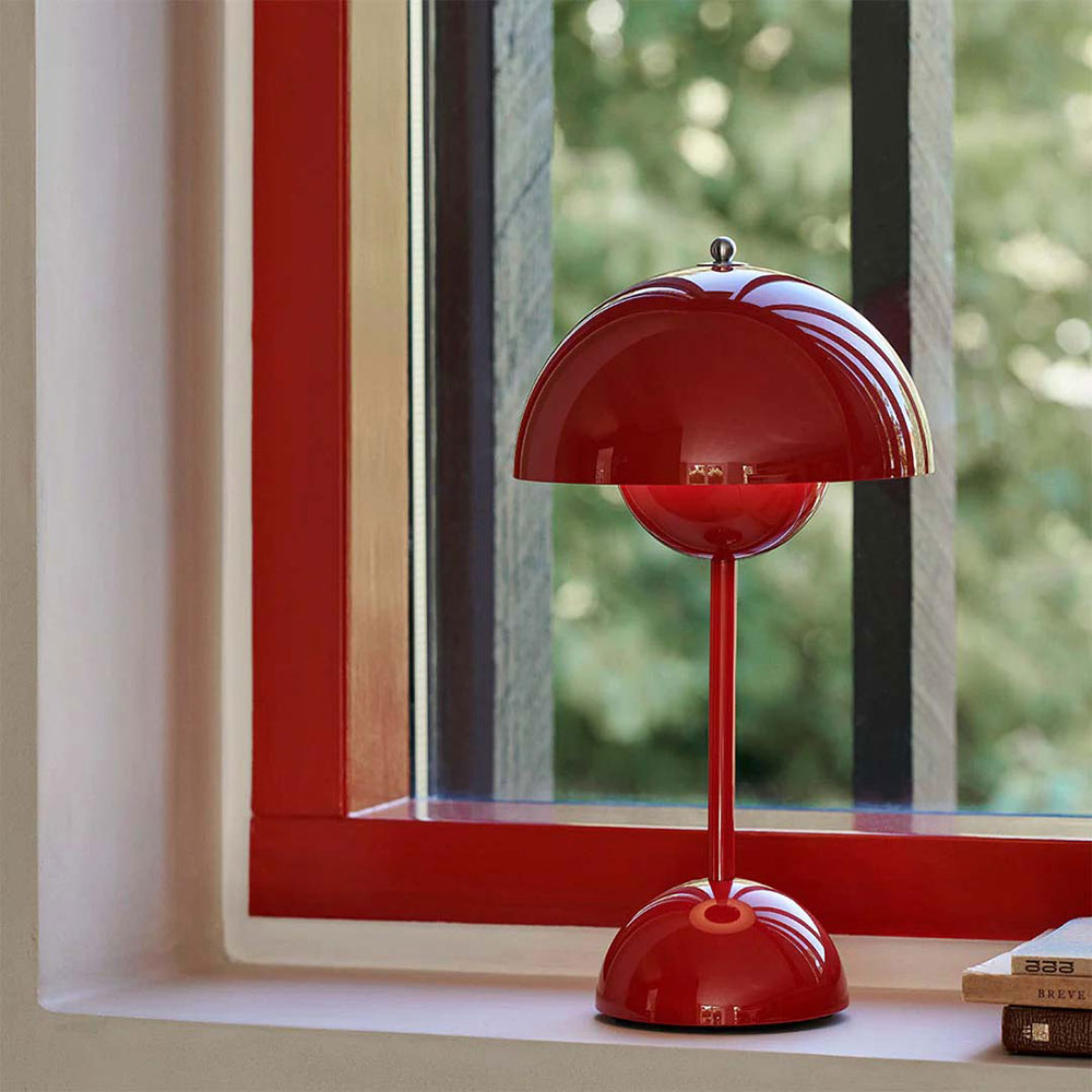 &Tradition Flowerpot Portable Table Lamp VP9, red, sitting on a windowsill