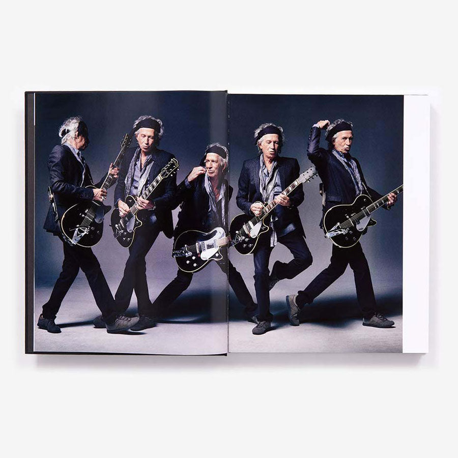 Mark Seliger: Photographs book, open and showing color photo of Keith Richards holding a guitar in multiple poses.