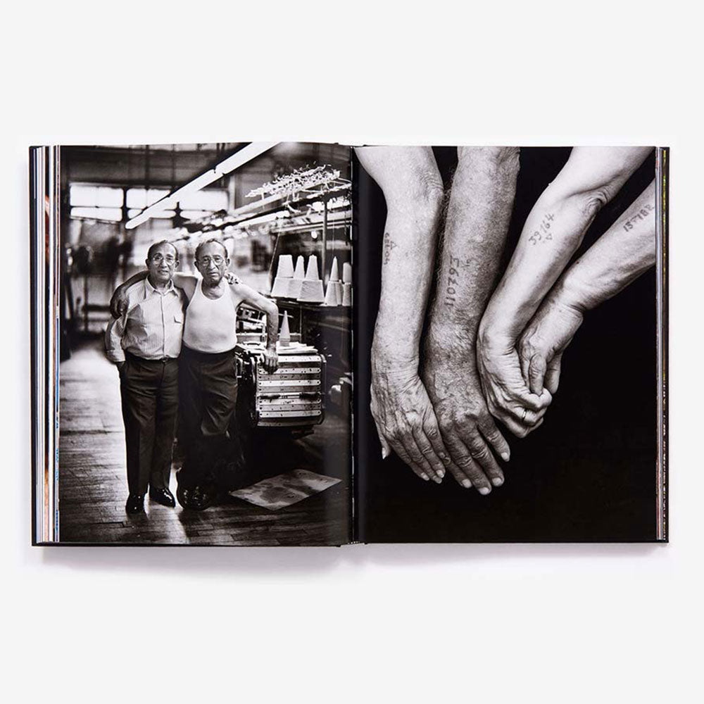 Mark Seliger: Photographs book, open and showing black and white photos. of arms.