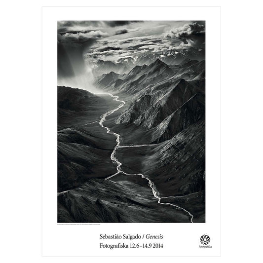 Black and white image of a creek through rocky area.  Exhibition title below: Sebastiao Salgado | Genesis