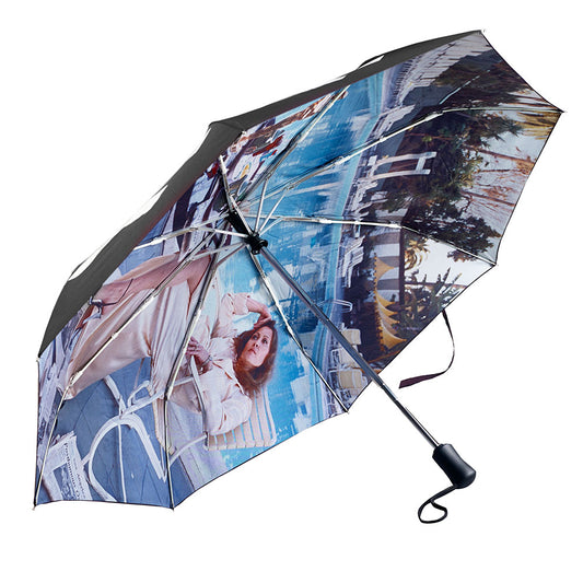 Automatic umbrella featuring Terry O'Neill "Faye Dunaway" photograph on the underside.