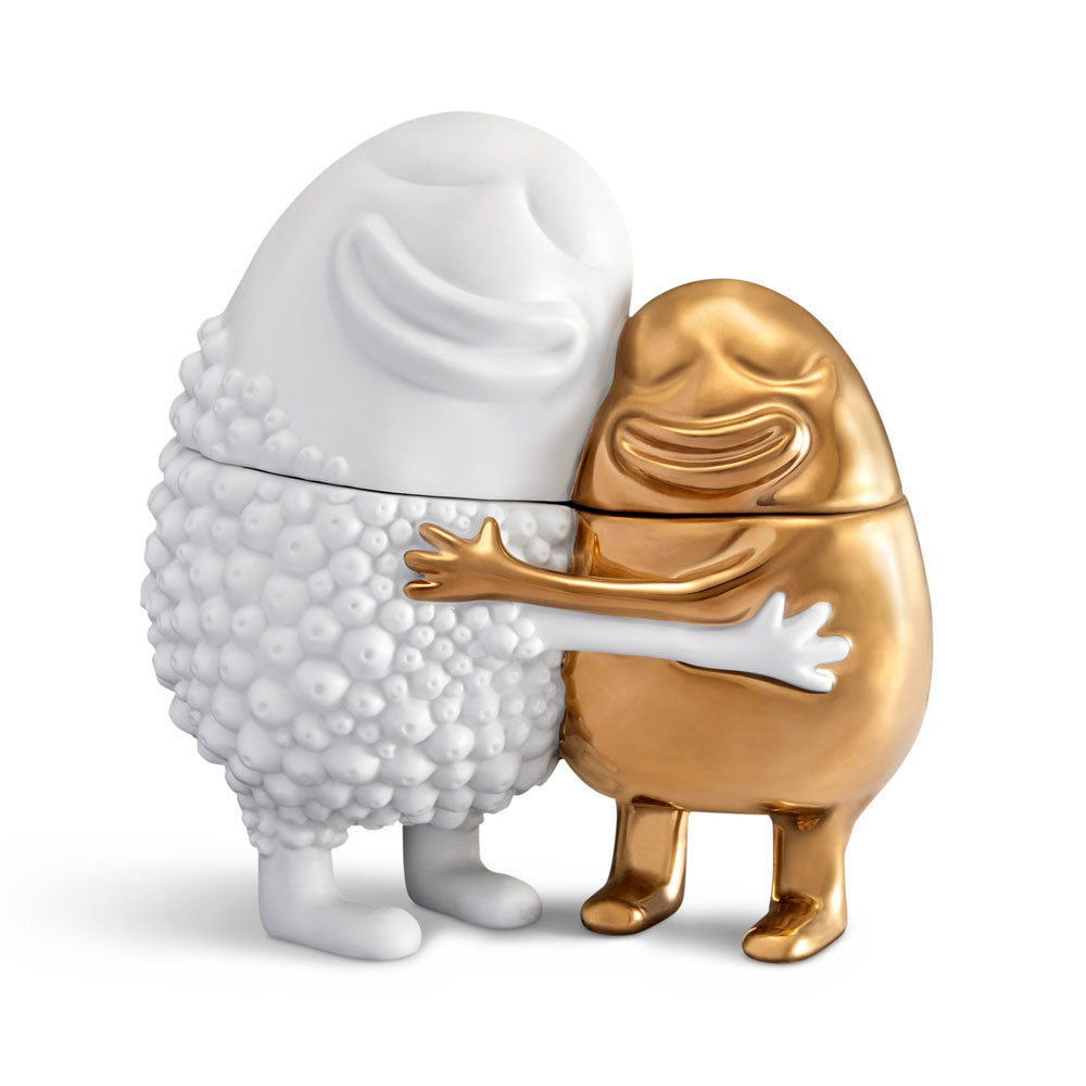 Tall white hugger and short gold hugger embracing