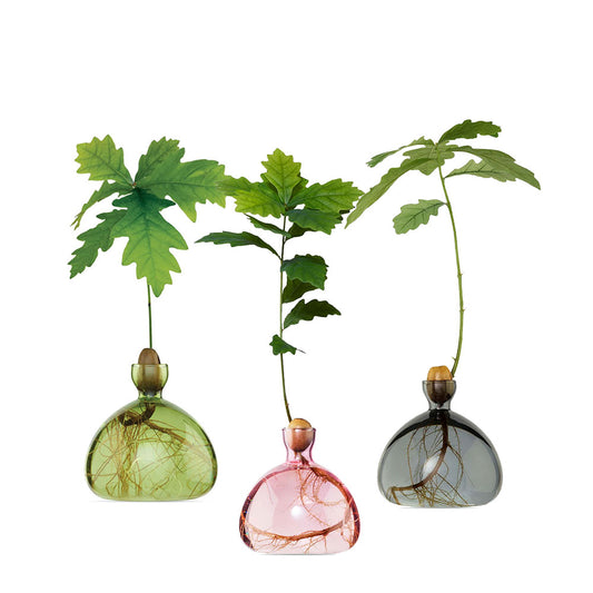 Group of three acorn-shaped vases:  Green, pink, smoke grey